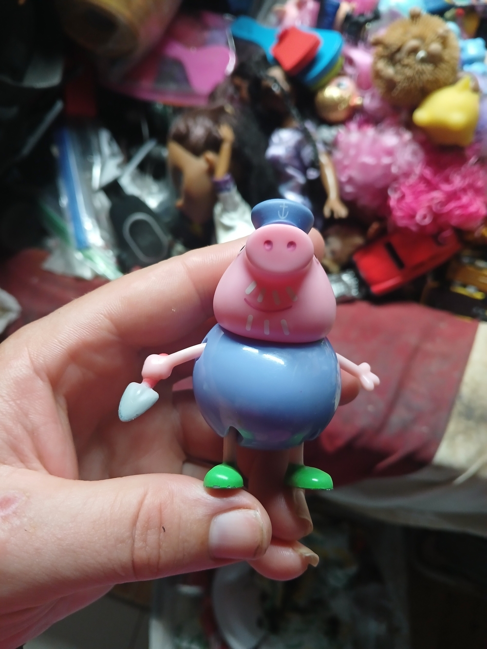 plastic Grandpa Pig action figure from the Peppa Pig toy collection